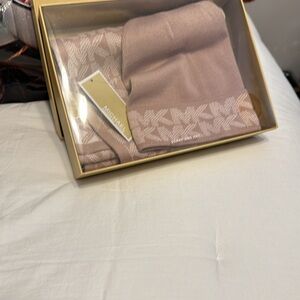 Hat and scarf set. New in box. Color is a blush/dusty pink.